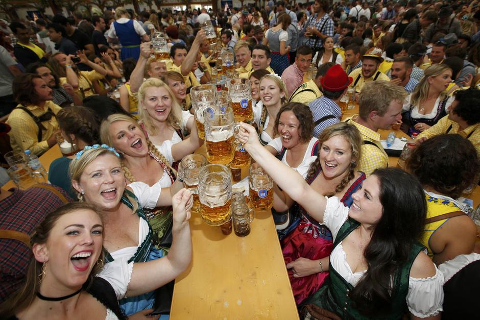 Visitors cheer with beer during the opening day of the 183rd Oktoberfest in Munich Visitors cheer with beer during the opening day of the 183rd Oktoberfest in Munich, Germany, September 17, 2016. REUTERS/Michaela Rehle MICHAELA REHLE