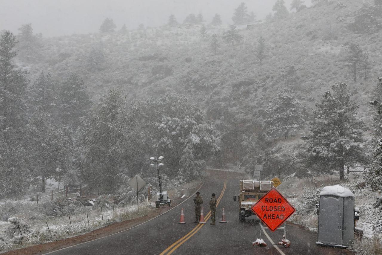 Central U.S. goes from heatwave to winter in a day as snowstorm rolls through the region