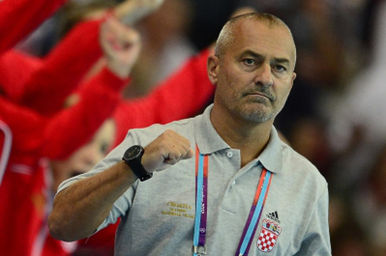 'Croatia\'s coach Vladimir Canjuga gestures during the women\'s quarter-final handball match Spain vs Croatia for the London 2012 Olympics Games on August 7, 2012 at the Copper Box hall in London. Spa