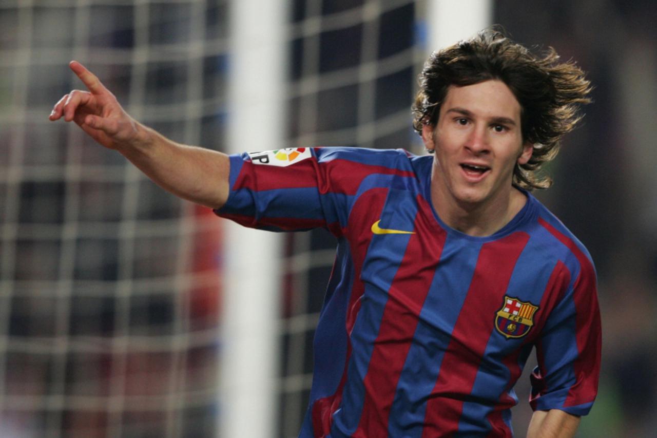 'Barcelona\'s Argentinian Leo Messi celebrates after scoring agains Real Athletic during their Spanish League football match at the Nou Camp stadium in Barcelona, 15 Jenuary 2006. AFP PHOTO/LLUIS GENE