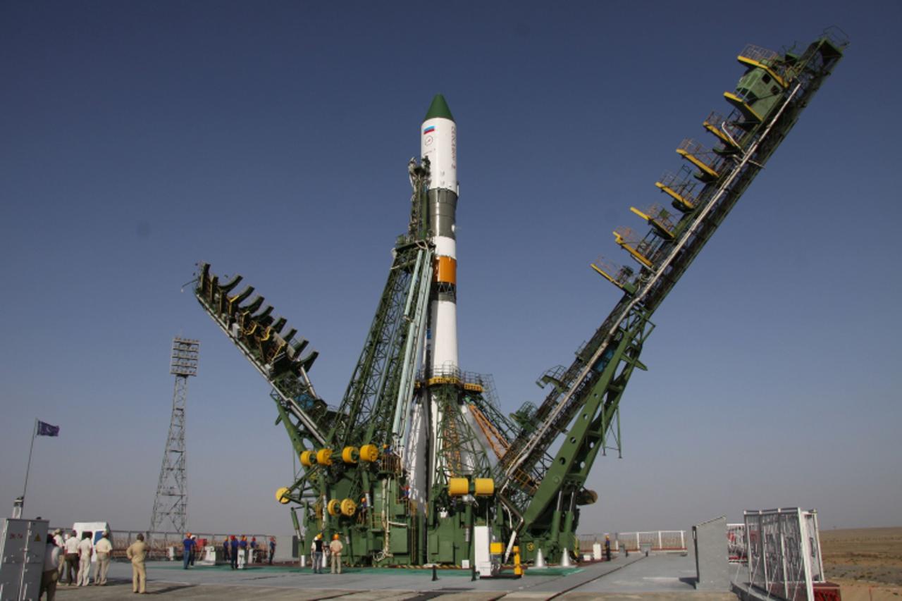'A Russian Progress-M-12M cargo ship carrying supplies for the International Space Station (ISS) stands on the launch pad at the Baikonour cosmodrome on August 24, 2011. A Russian supply ship carrying