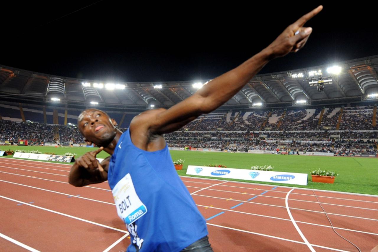 'Jamaican Usain Bolt celebrates after winning the Men\'s 100m race as part of the Golden Gala event, the third leg of the Diamond League series meeting at Olympic stadium in Rome on May 26, 2011. Bolt