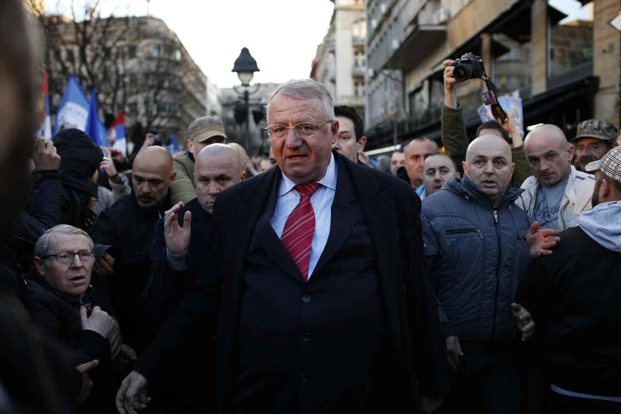 Serbian ultra-nationalist leader Vojislav Seselj surrounded by his supporters arrives for an anti-government rally in Belgrade March 24, 2016. REUTERS/Marko Djurica