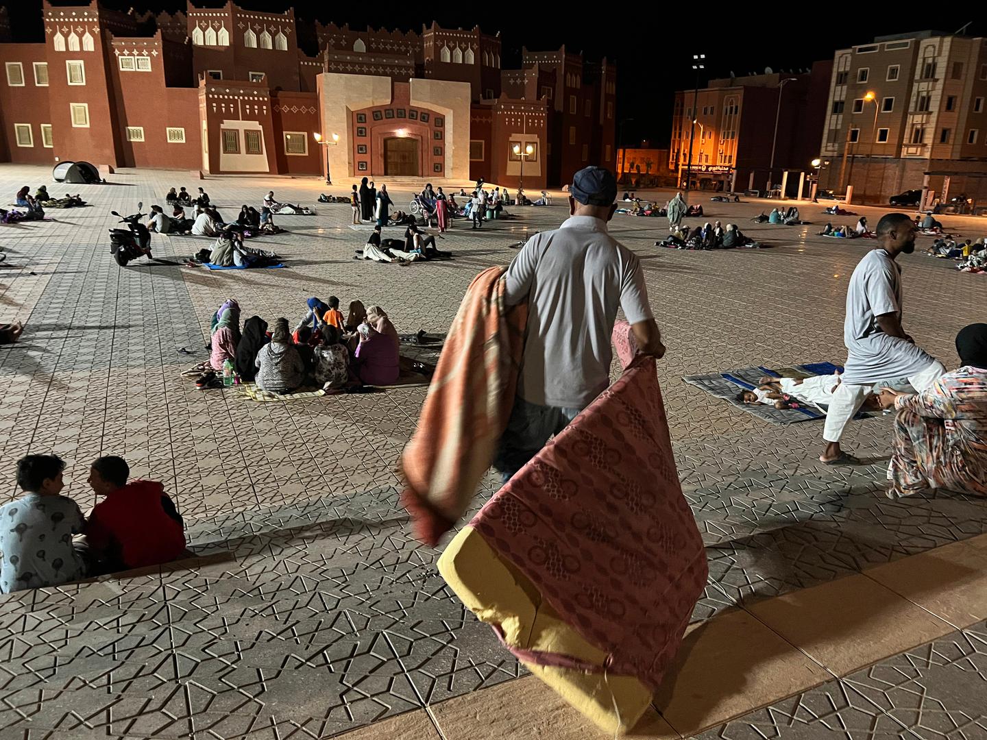 (230909) -- OUARZAZATE, Sept. 9, 2023 (Xinhua) -- This photo taken with a mobile phone shows residents taking shelter at an open space after an earthquake in Ouarzazate, Morocco, Sept. 9, 2023. The death toll from a strong earthquake that struck Morocco Friday night has risen to 296, the country's Interior Ministry said. (Xinhua/Wang Dongzhen) Photo: Wang Dongzhen/XINHUA