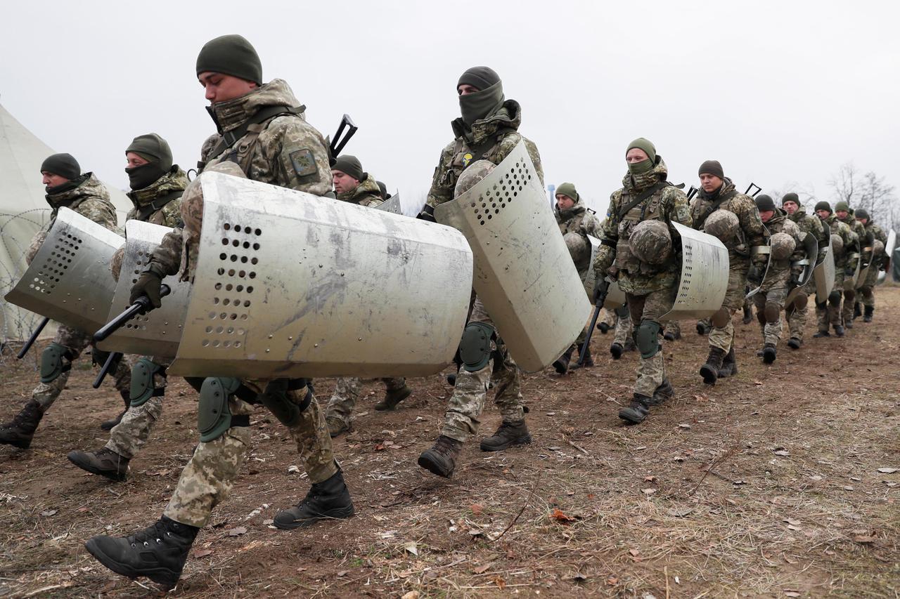 Members of the Ukrainian State Border Guard Service attend a training session near the border with Belarus and Poland in Volyn region