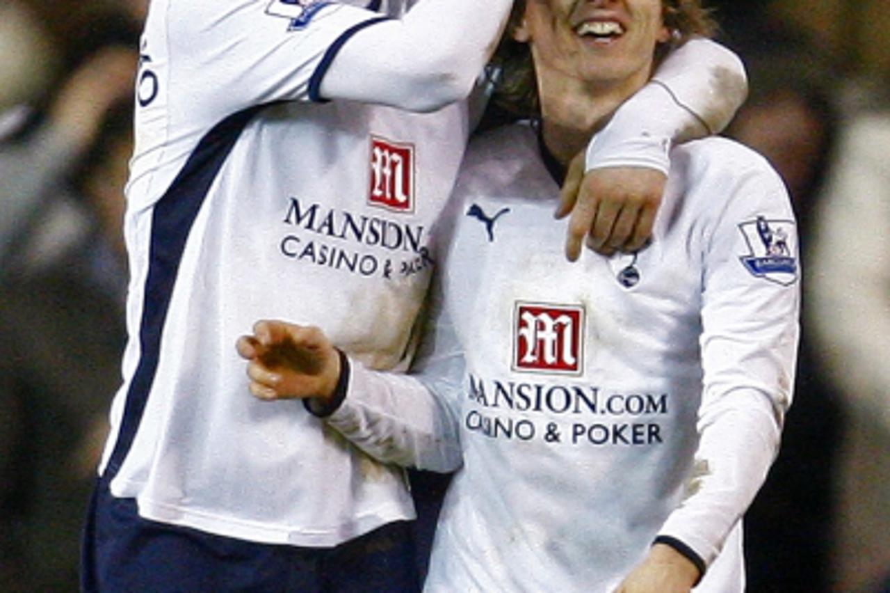 'Luka Modric (R) of Tottenham Hotspur celebrates his goal against Wigan Athletic with Roman Pavlyuchenko during their English FA Cup third round soccer match at White Hart Lane in London January 2, 20