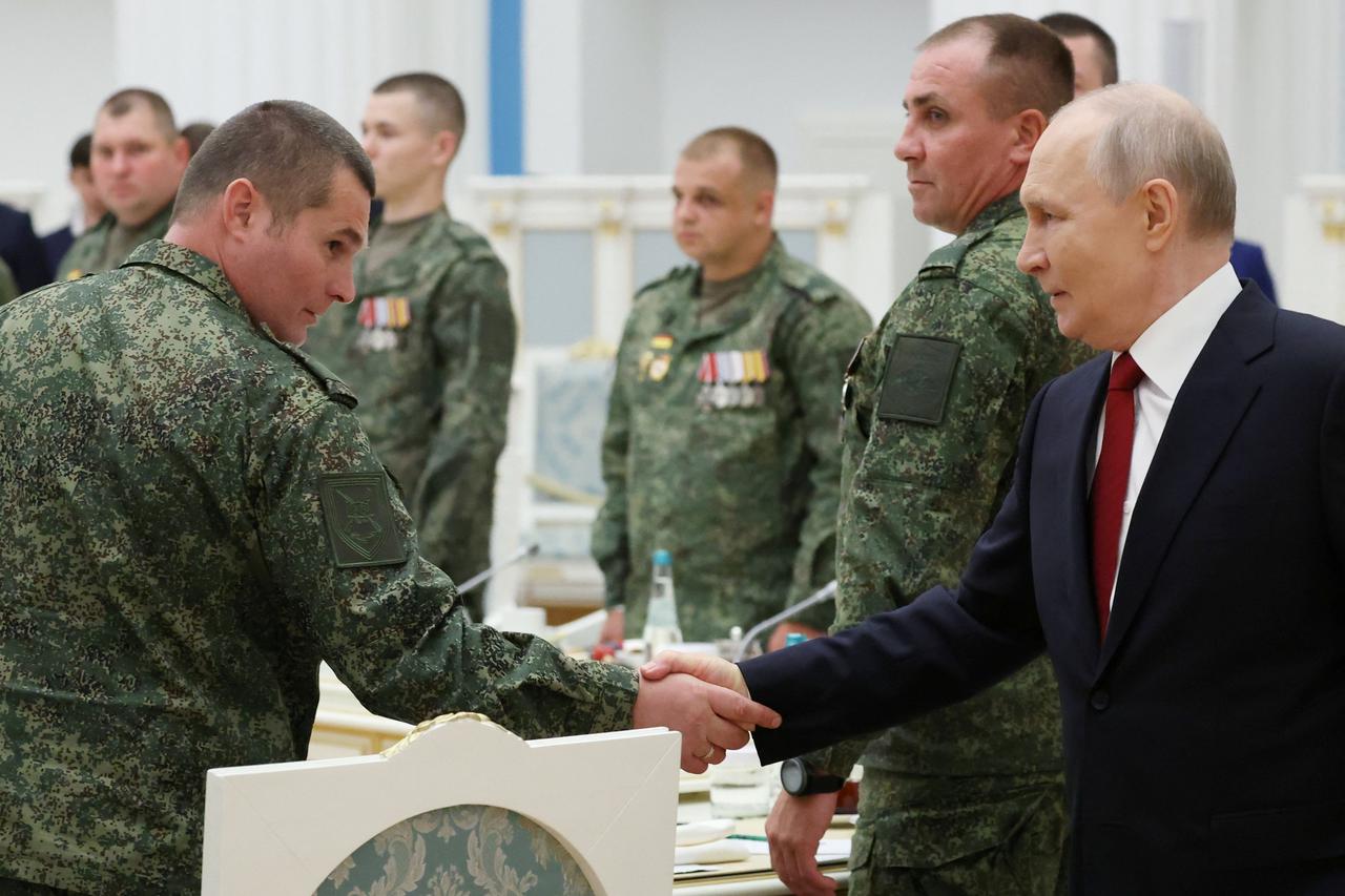 Russia's President Putin meets with service members in Moscow
