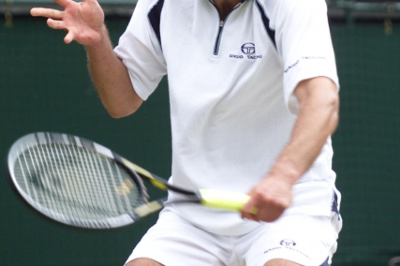 'Ivanisevic v Rafter NO COMMERCIAL USE: Goran Ivanisevic of Croatia in action against Australia\'s Pat Rafter during the Mens Final of the 2001 Lawn Tennis Championships at Wimbledon, London.'