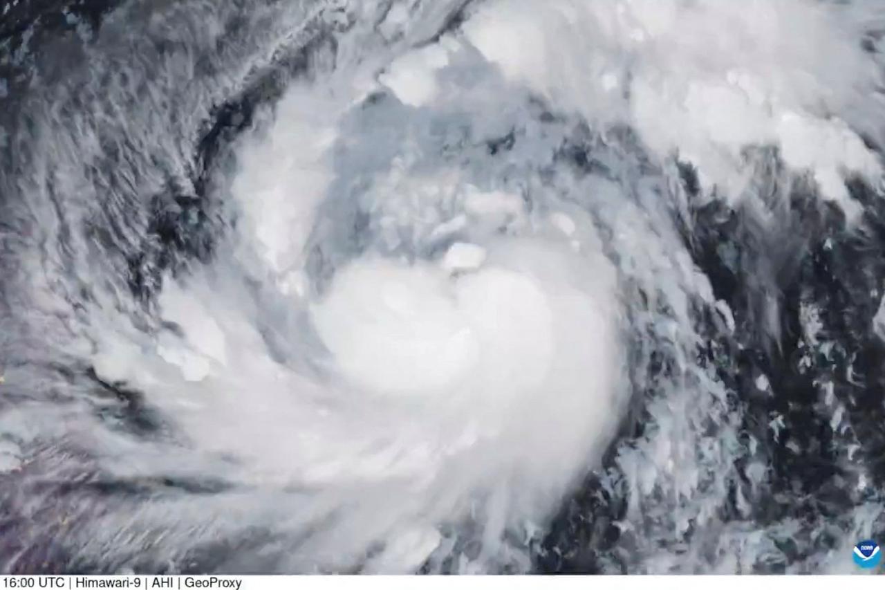 A satellite image shows Storm Fung-Wong, which has intensified into a typhoon