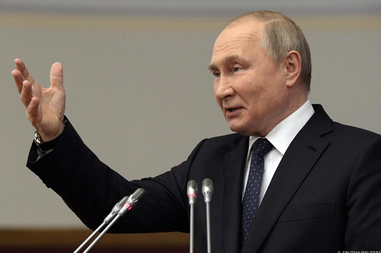 Russian President Vladimir Putin delivers a speech during a meeting of the Council of Legislators at the Federal Assembly in Saint Petersburg