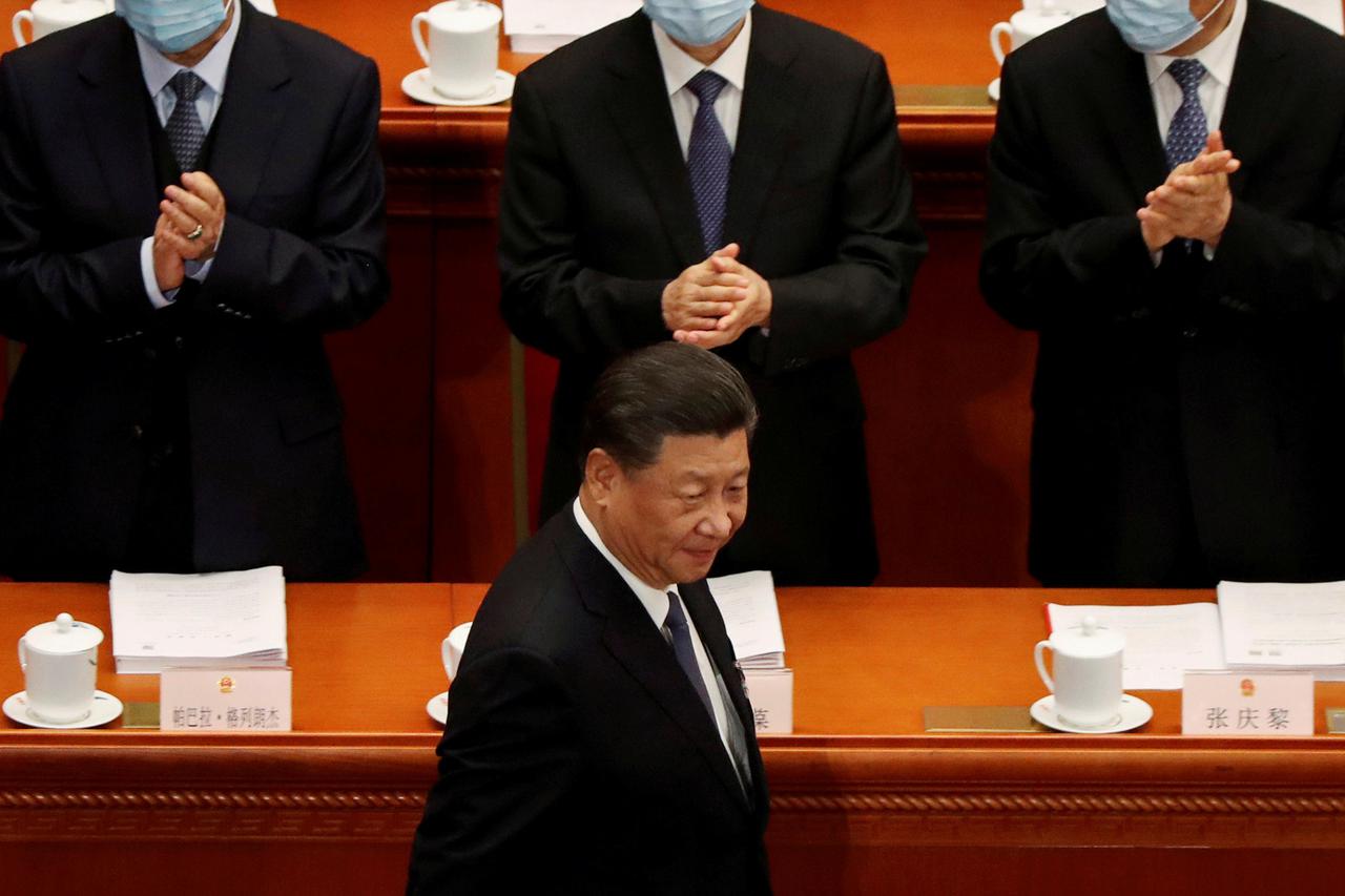 Chinese President Xi Jinping arrives for the opening session of NPC in Beijing