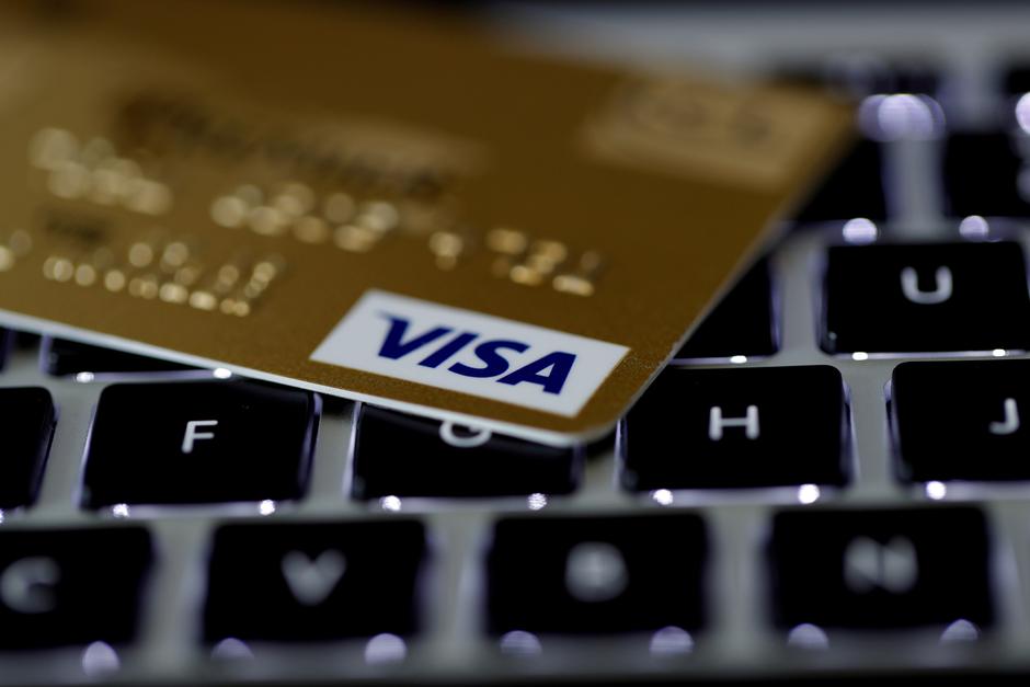 FILE PHOTO: FILE PHOTO: A Visa credit card is seen on a computer keyboard in this picture illustration