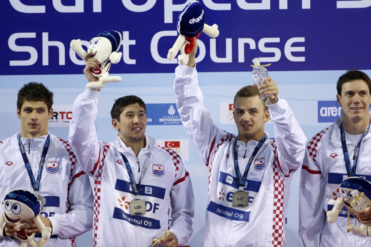 'Croatia\'s relay team members Mario Delac, Mario Todorovic, Alexei Puninski and Duje Draganja (L-R) pose with their silver medals during the medal ceremony for the men\'s 4x50m freestyle final at the