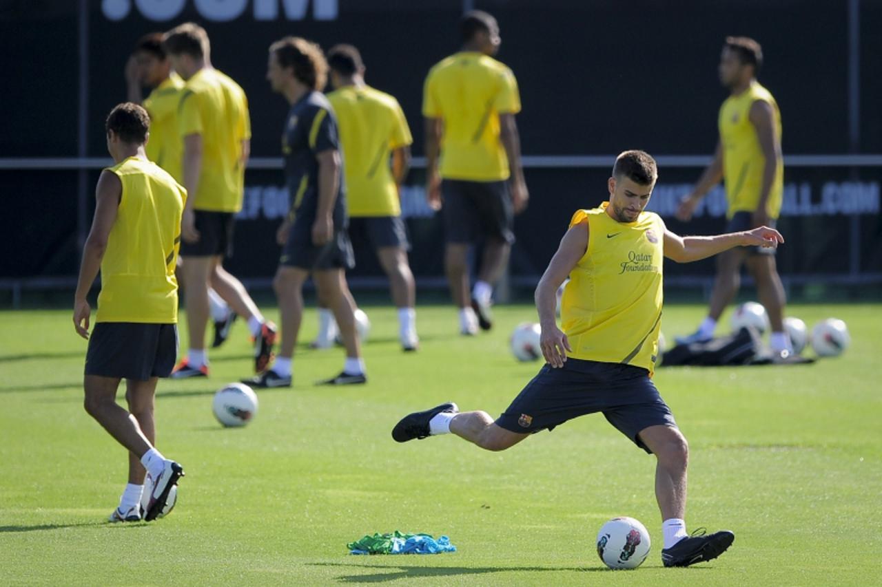 'Barcelona\'s defender Gerard Pique (R) takes part in a training session, on July 19, 2011, at the Sports Center FC Bacelona Joan Gamper, in San Juan Despi, near Barcelona. AFP PHOTO / JOSEP LAGO '