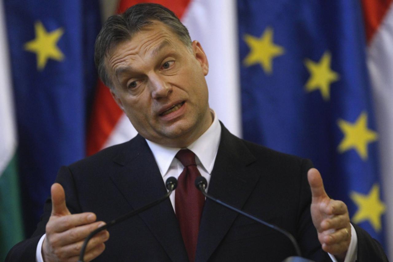 \'Hungarian Prime Minister Viktor Orban gestures at a news conference with European Commission President Jose Manuel Barroso (not pictured) in Parliament at Budapest January 7, 2011. Barroso welcomed 