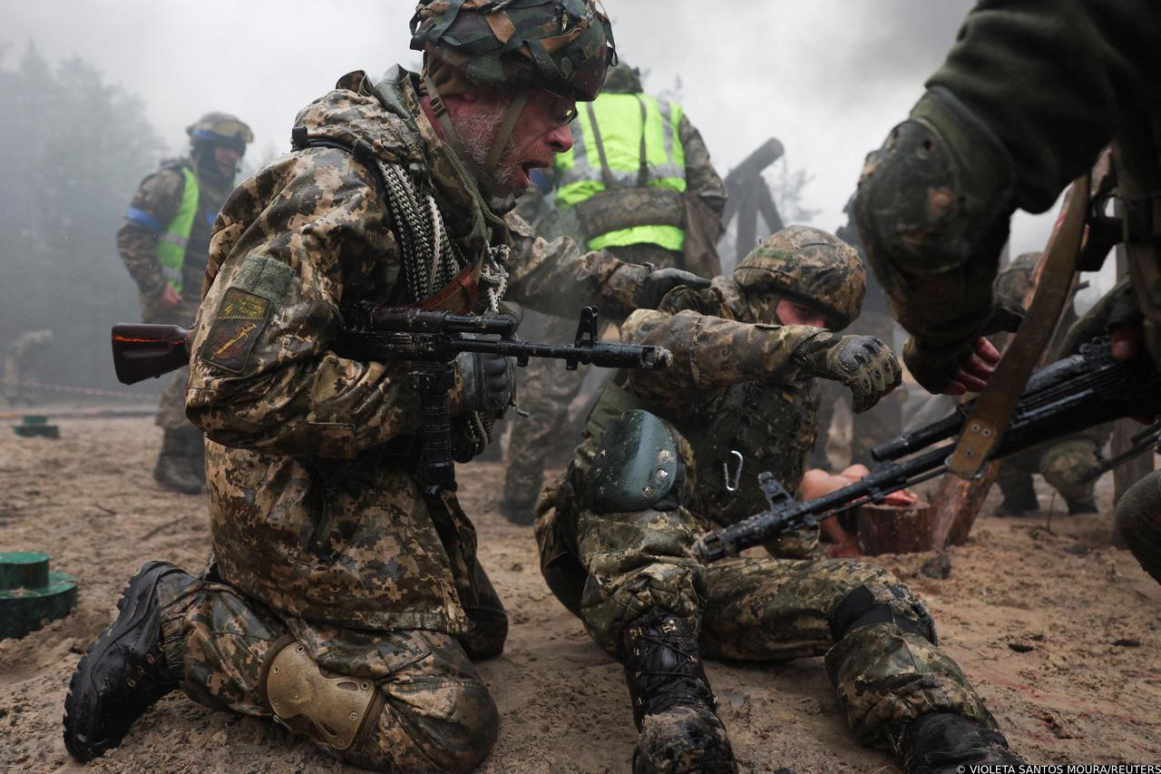 Ukrainian soldiers take part in a military drill on psychological combat training