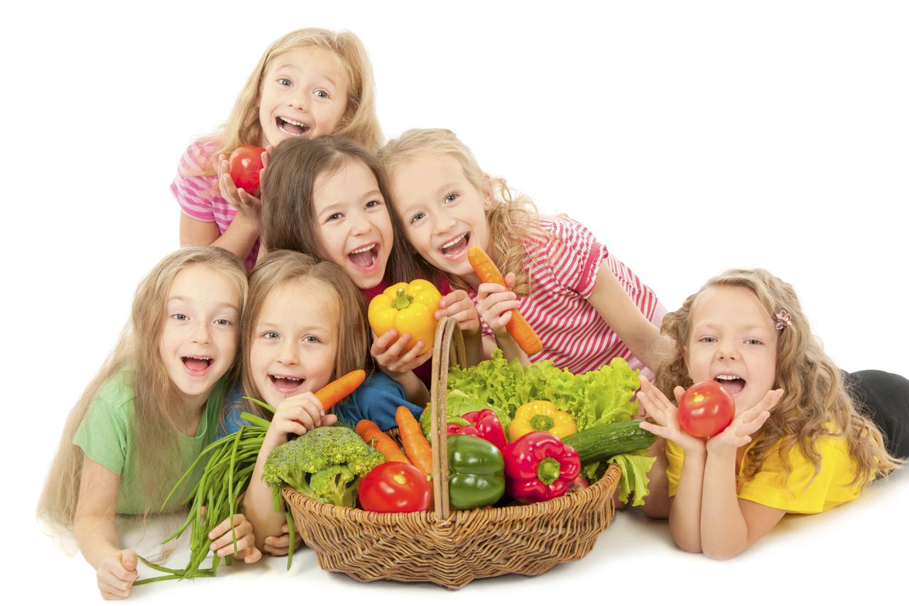 Happy children with vegetables