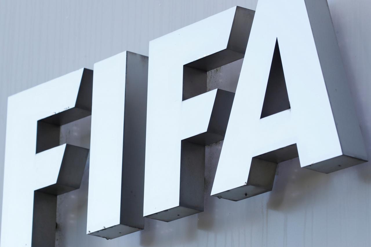 FILE PHOTO: FIFA's logo is seen in front of its headquarters in Zurich