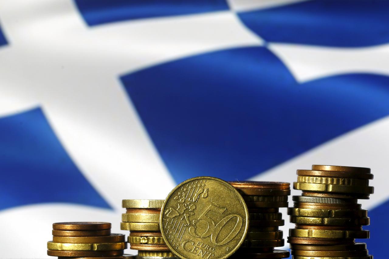 Euro coins are seen in front of a displayed Greece flag in this photo illustration taken in Zenica, Bosnia and Herzegovina, June 29, 2015. REUTERS/Dado Ruvic