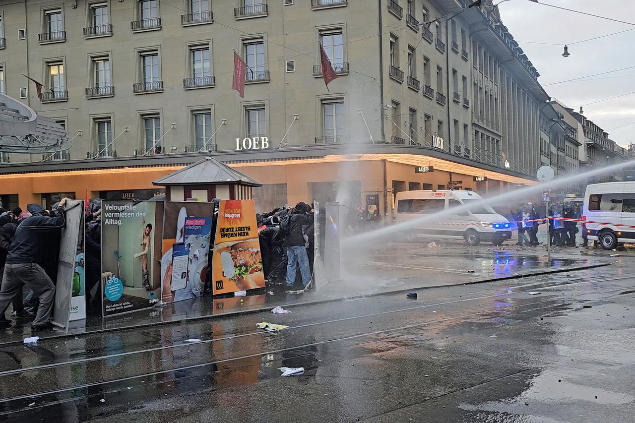 Pro-Palestine protesters clash with police during a demonstration in Bern