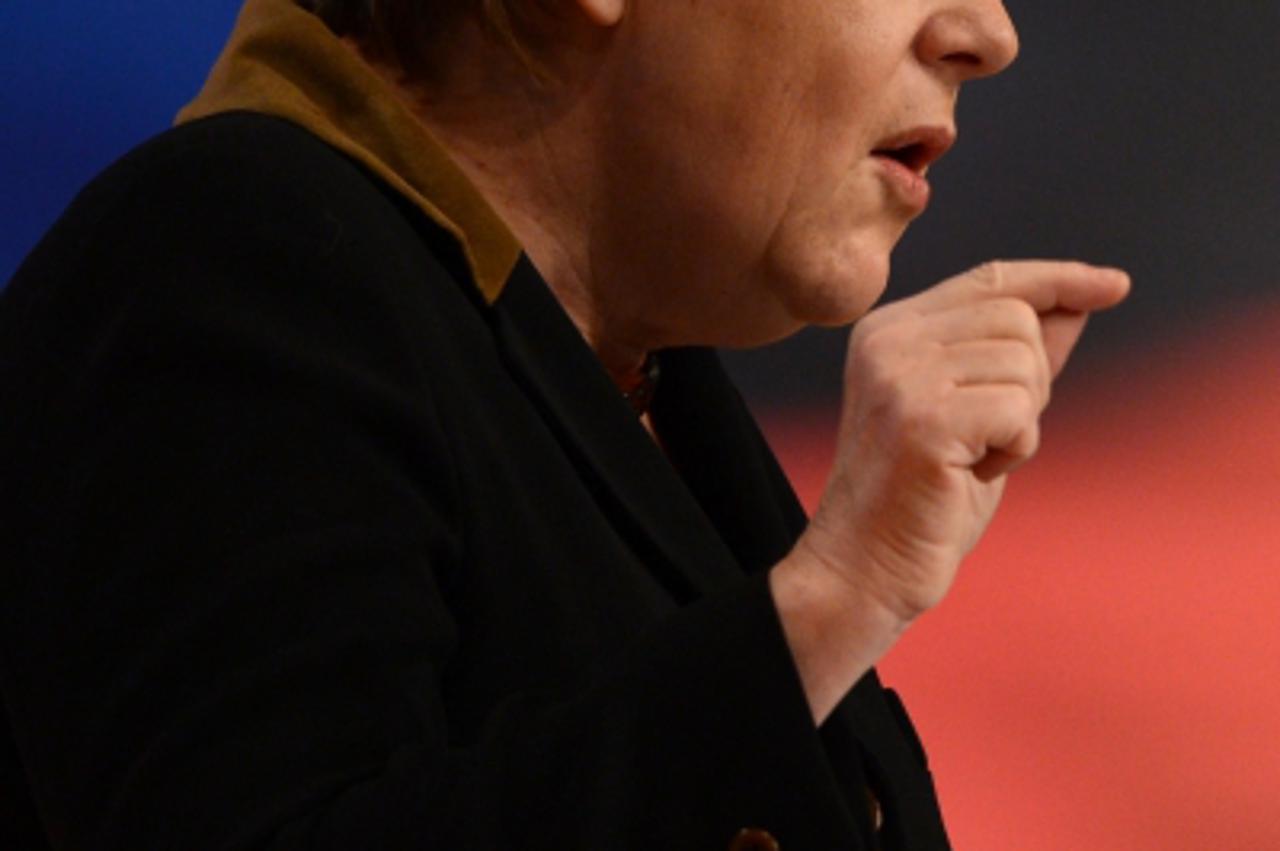 'German Chancellor Angela Merkel gives a speech during a congress of Germany's ruling conservative Christian Democratic Union (CDU) party on December 4, 2012 in Hanover, central Germany. Germany's A