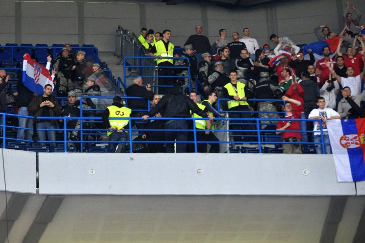 'Serbia (R) and Croatia\'s (L) supporters are pictured before the men\'s EHF Euro 2012 Handball Championship semifinal match Serbia vs Croatia on January 27, 2012 at the Beogradska Arena in Belgrade. 