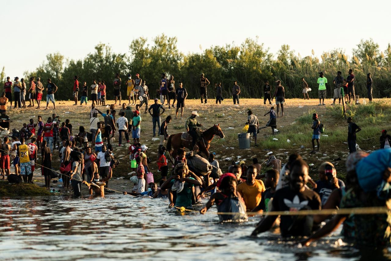 Asylum-seeking migrants in the U.S. return to Mexican side of the border, in Ciudad Acuna
