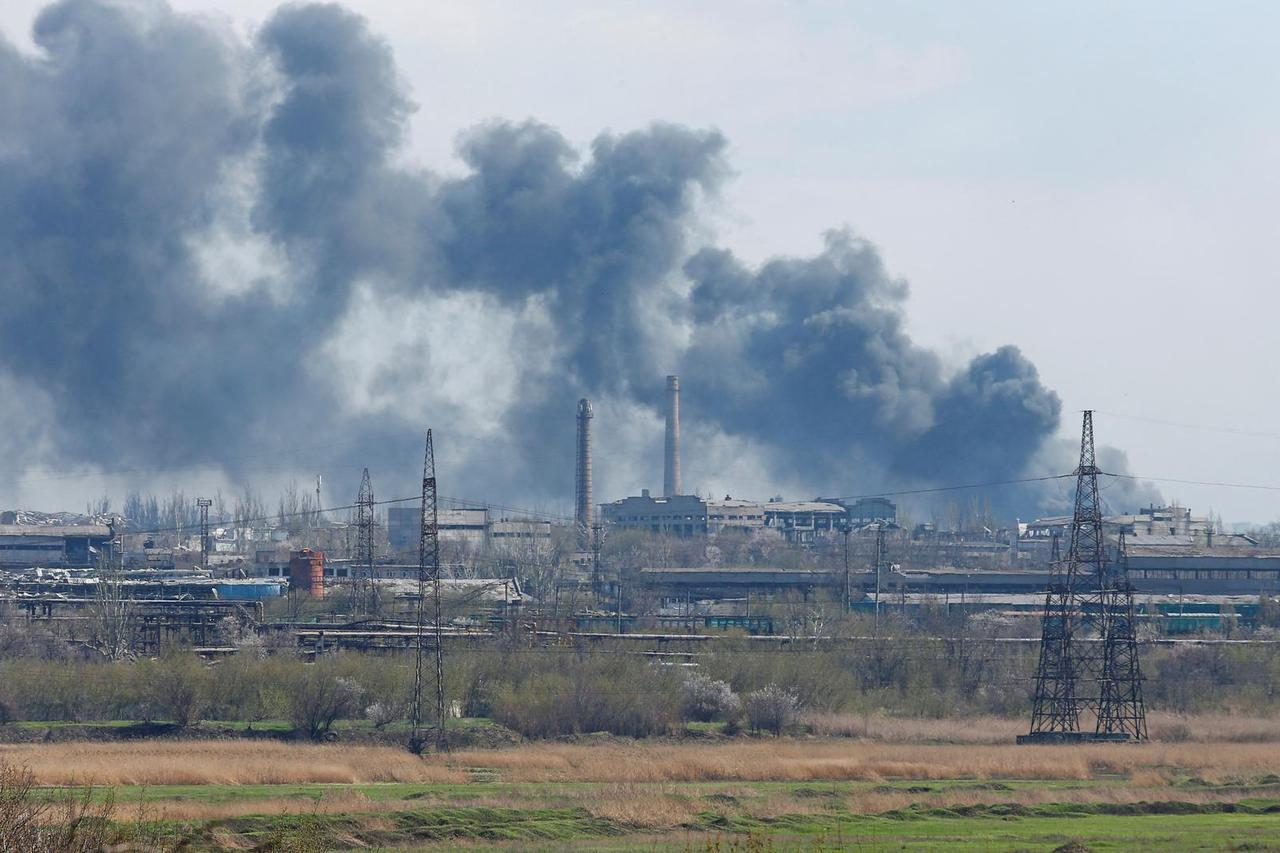 Smoke rises above a plant of Azovstal Iron and Steel Works company in Mariupol