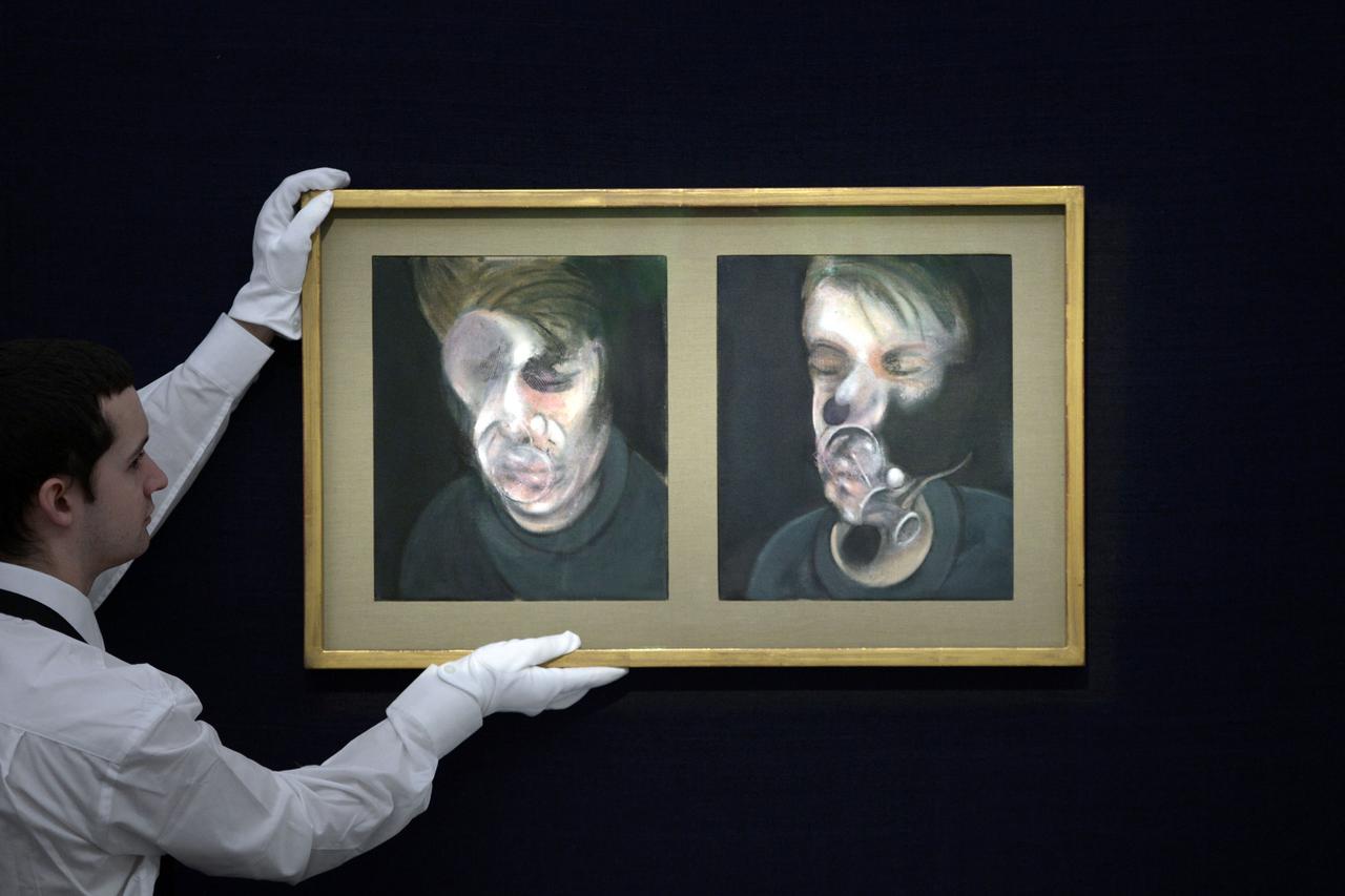 Contemporary art sales at Sotheby's - LondonA Sotheby's employee hangs Francis Bacon's Two Studies for a Self-Portrait, 1977 (estimated at 13-18 million) ahead of the preview facility for the forthcoming contemporary art sales at Sotheby's auction house, 