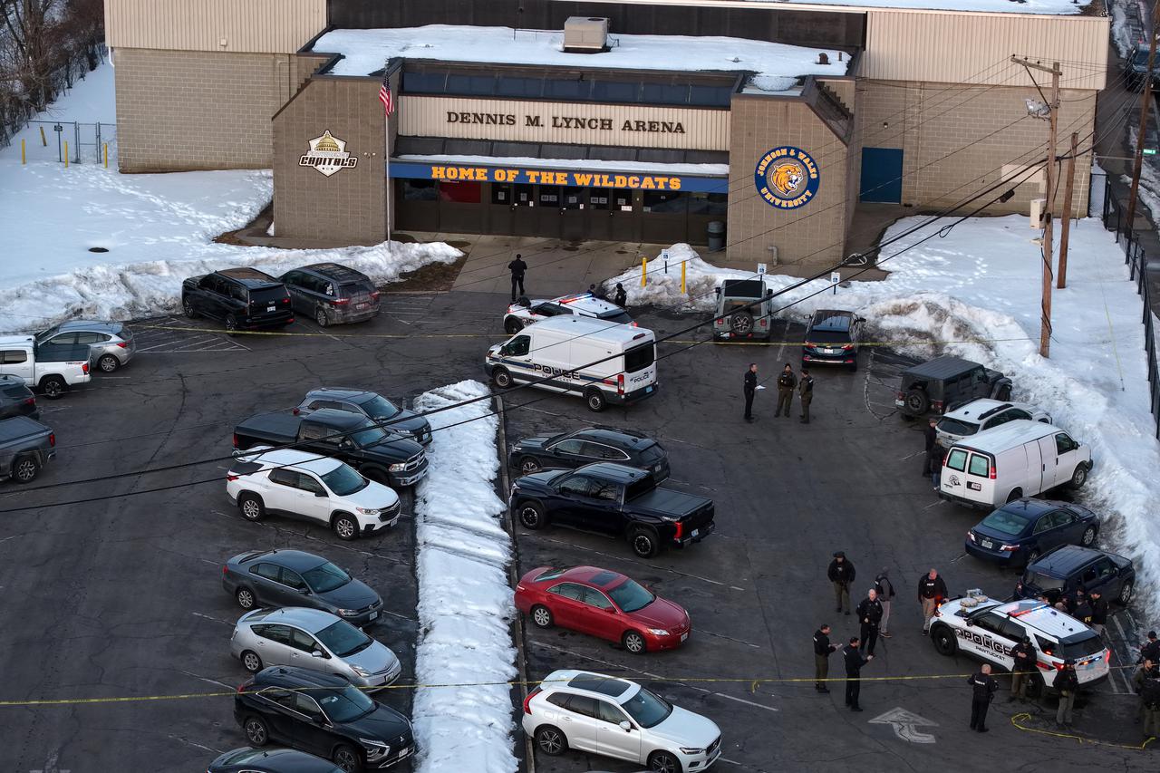Police and emergency vehicles are seen outside the Dennis M Lynch Arena, an indoor ice skating rink, after a shooting in Pawtucket