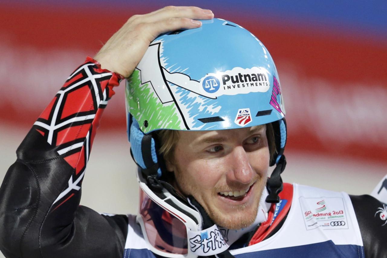 'Ted Ligety of the U.S. reacts during the men\'s super combined Slalom race at the World Alpine Skiing Championships in Schladming February 11, 2013. REUTERS/Leonhard Foeger (AUSTRIA  - Tags: SPORT SK