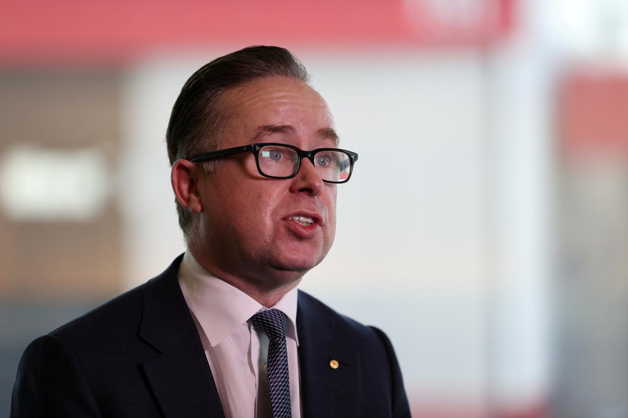 FILE PHOTO: Qantas' CEO speaks with members of the media at an event in Sydney