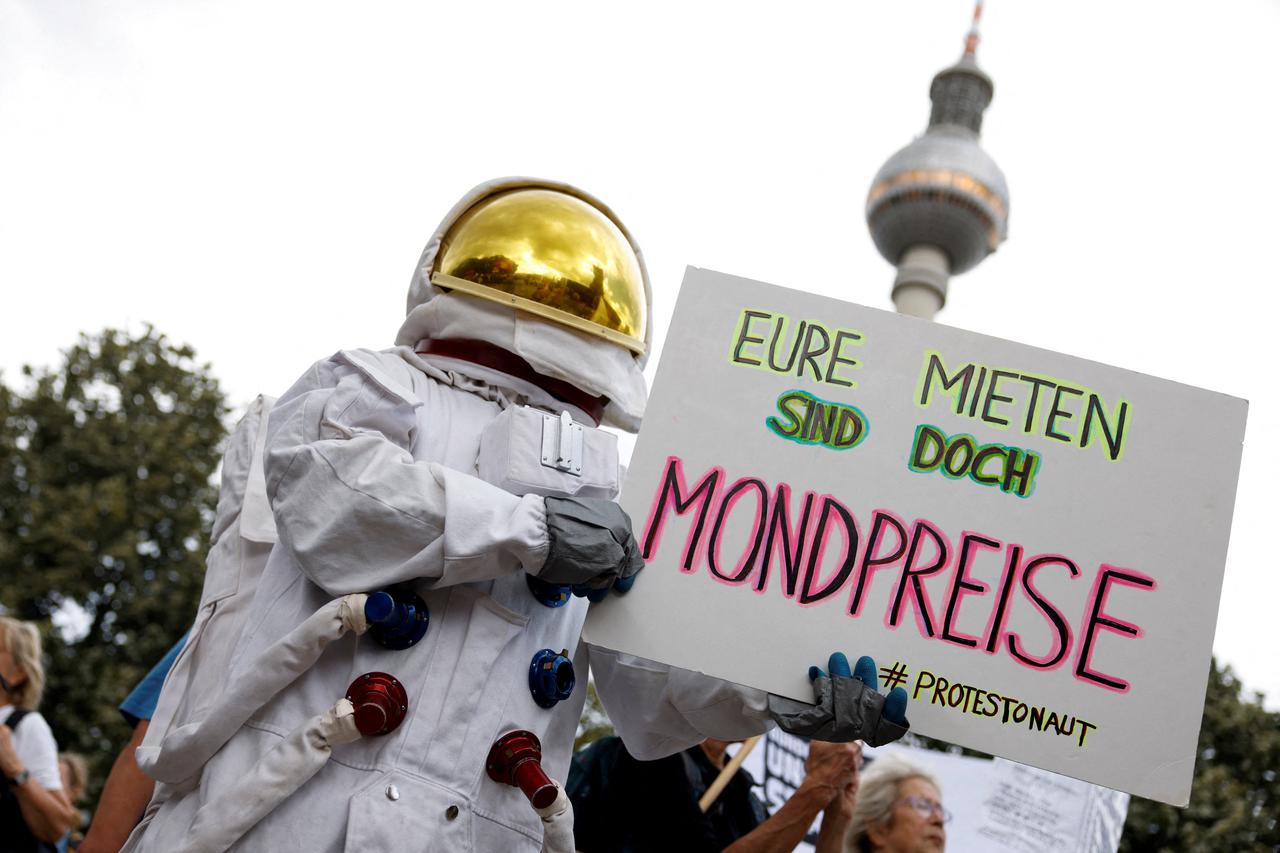 A demonstrator wearing an astronaut costume