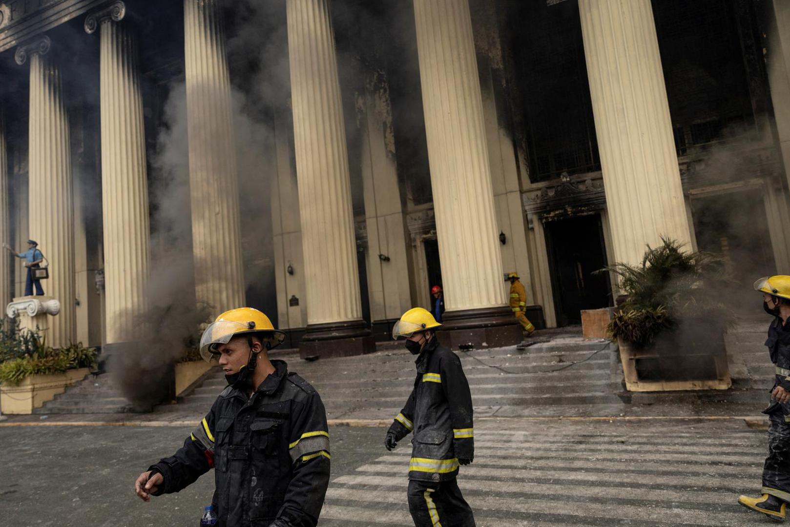 Firefighters walk out of the burning Manila Central Post Office building after a massive fire, in Manila, Philippines, May 22, 2023. REUTERS/Eloisa Lopez Photo: ELOISA LOPEZ/REUTERS
