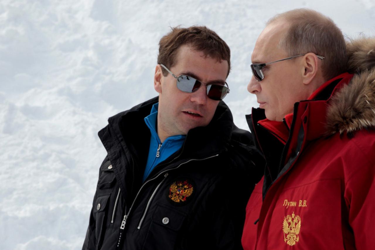 'Russian President Dmitry Medvedev (L) and Prime Minister Vladimir Putin visit the newly built Rosa Khutor ski resort in Krasnaya Polyana near the Black Sea resort of Sochi, southern Russia, on  Febru