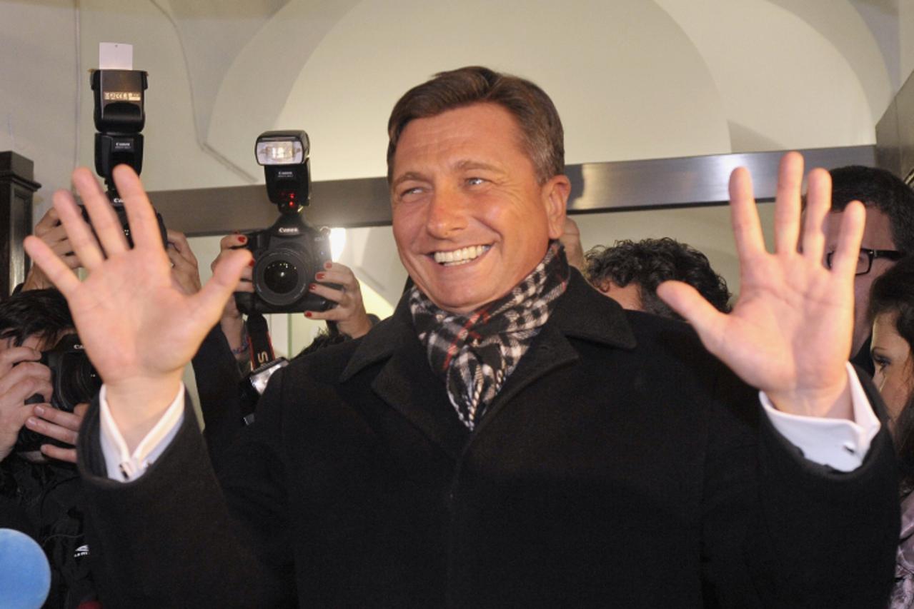 'Former prime minister Borut Pahor celebrates his victory with supporters after the unofficial results were announced in the second round of Presidential elections in Ljubljana December 2, 2012. REUTE
