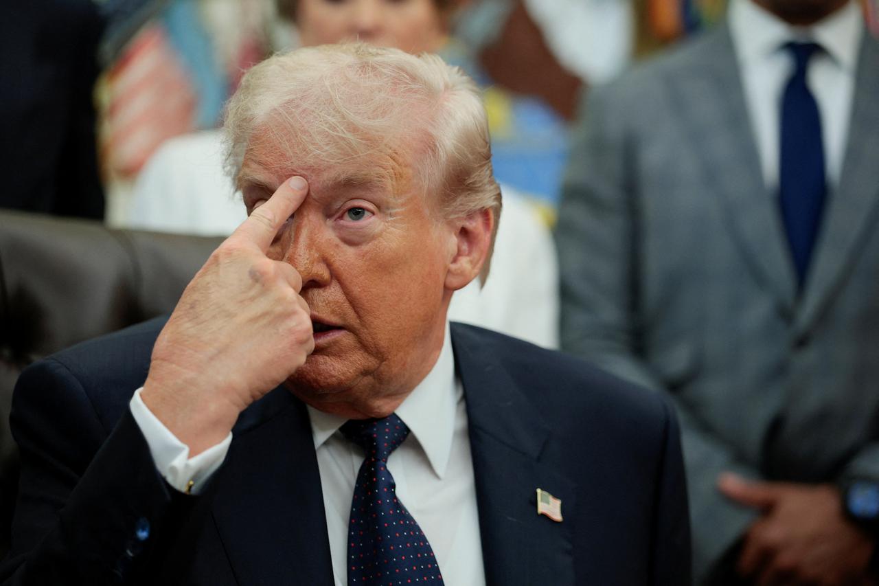 U.S. President Donald Trump attends an event to sign a memorandum in the Oval Office at the White House