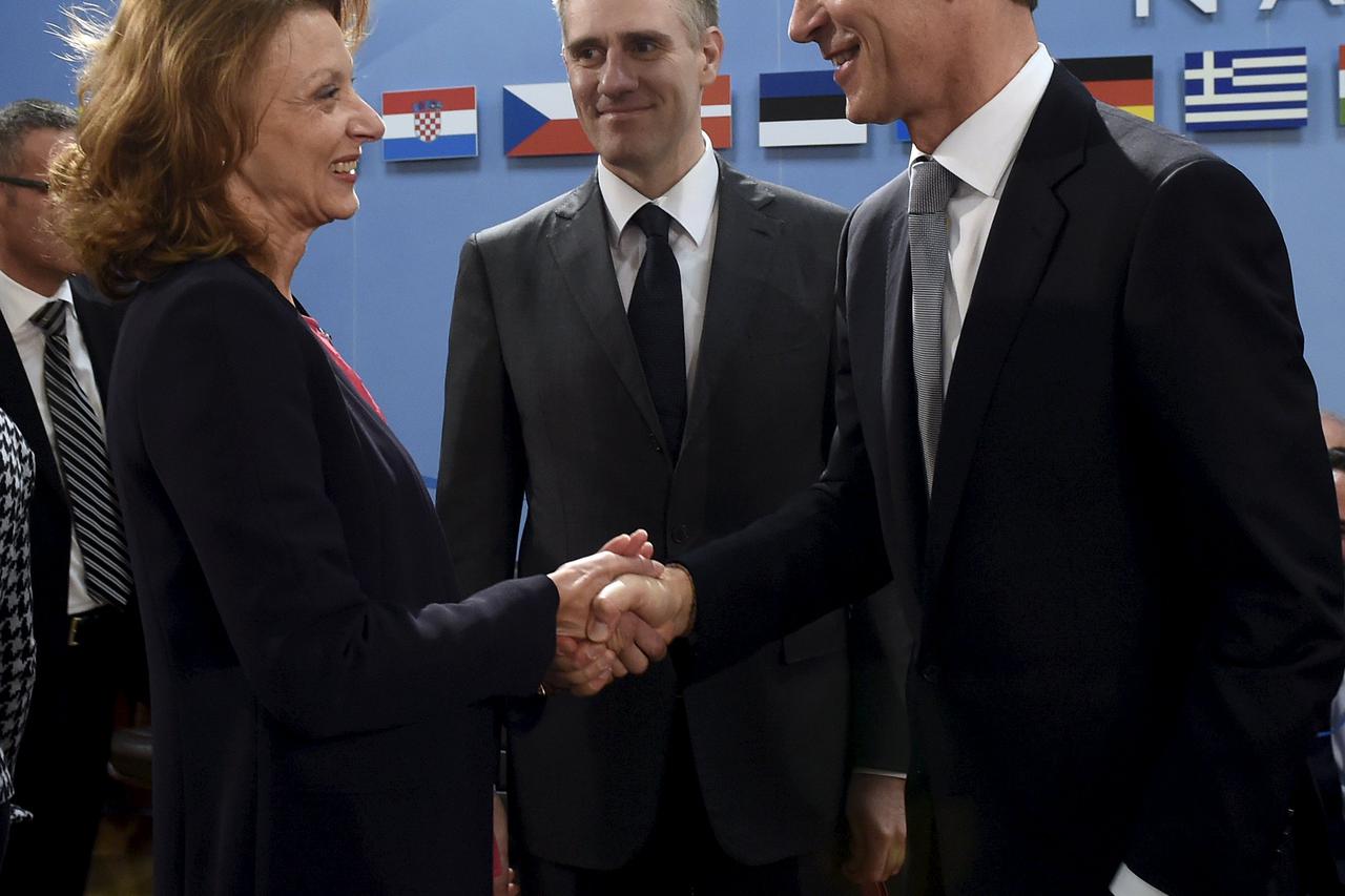 (L to R) Minister of Defense of Montenegro Milica Pejanovic and Foreign Minister of Montenegro Igor Luksic and NATO Secretary General Jens Stoltenberg take part in a Foreign Affairs meeting at the NATO headquarters in Brussels on December 2, 2015. REUTERS