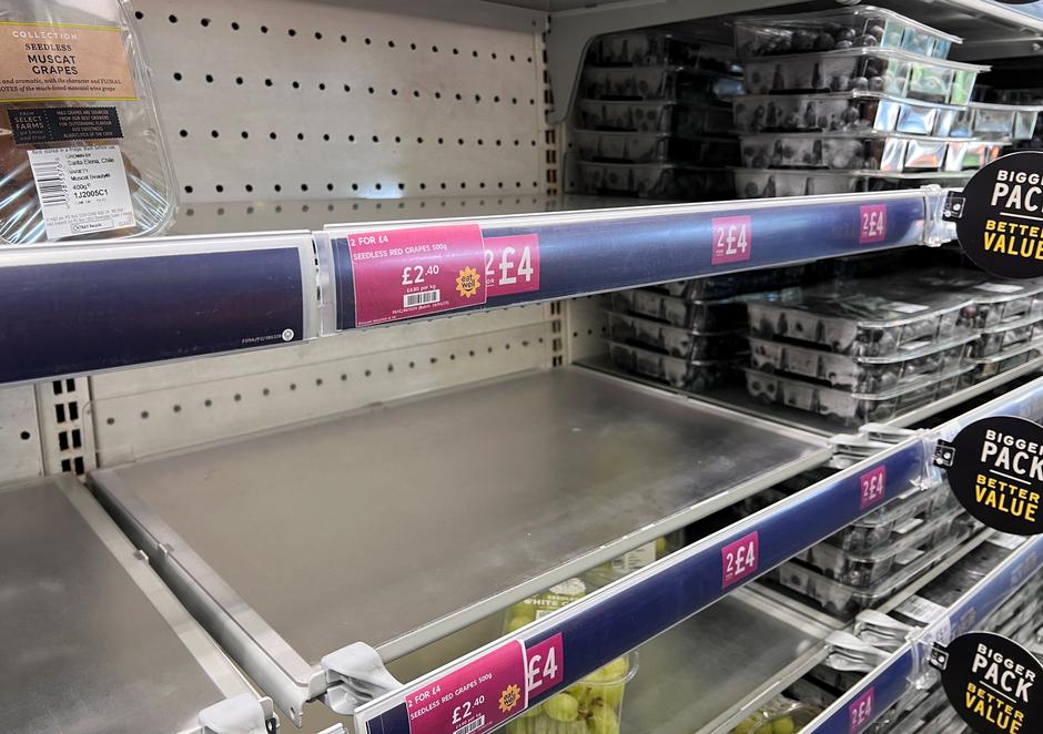 Empty shelves are seen at an M&S Food Hall in London