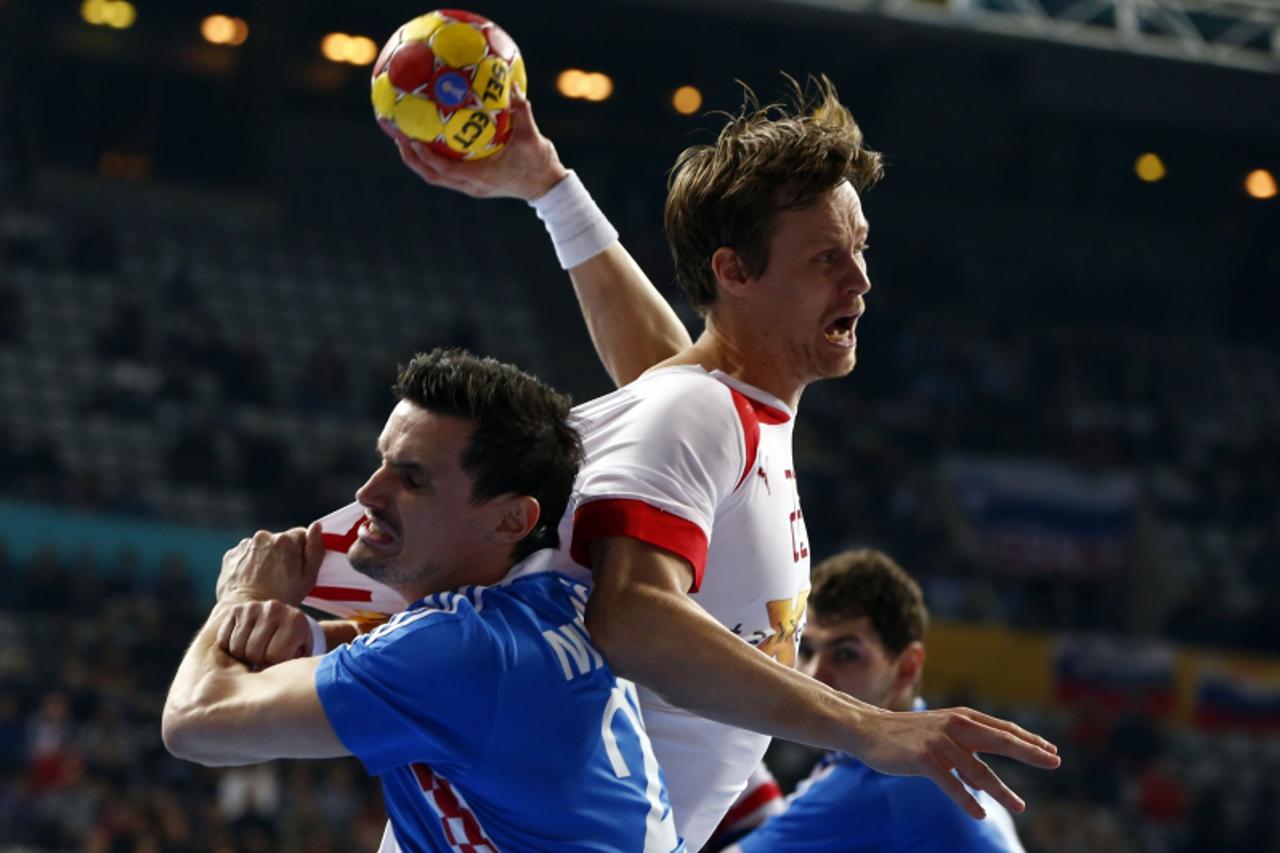 'Denmark\'s Henrik Toft Hansen (R) attempts to score against Croatia\'s Ivan Nincevic during their Men\'s Handball World Championship semi-final match at the Palau Sant Jordi arena in Barcelona Januar