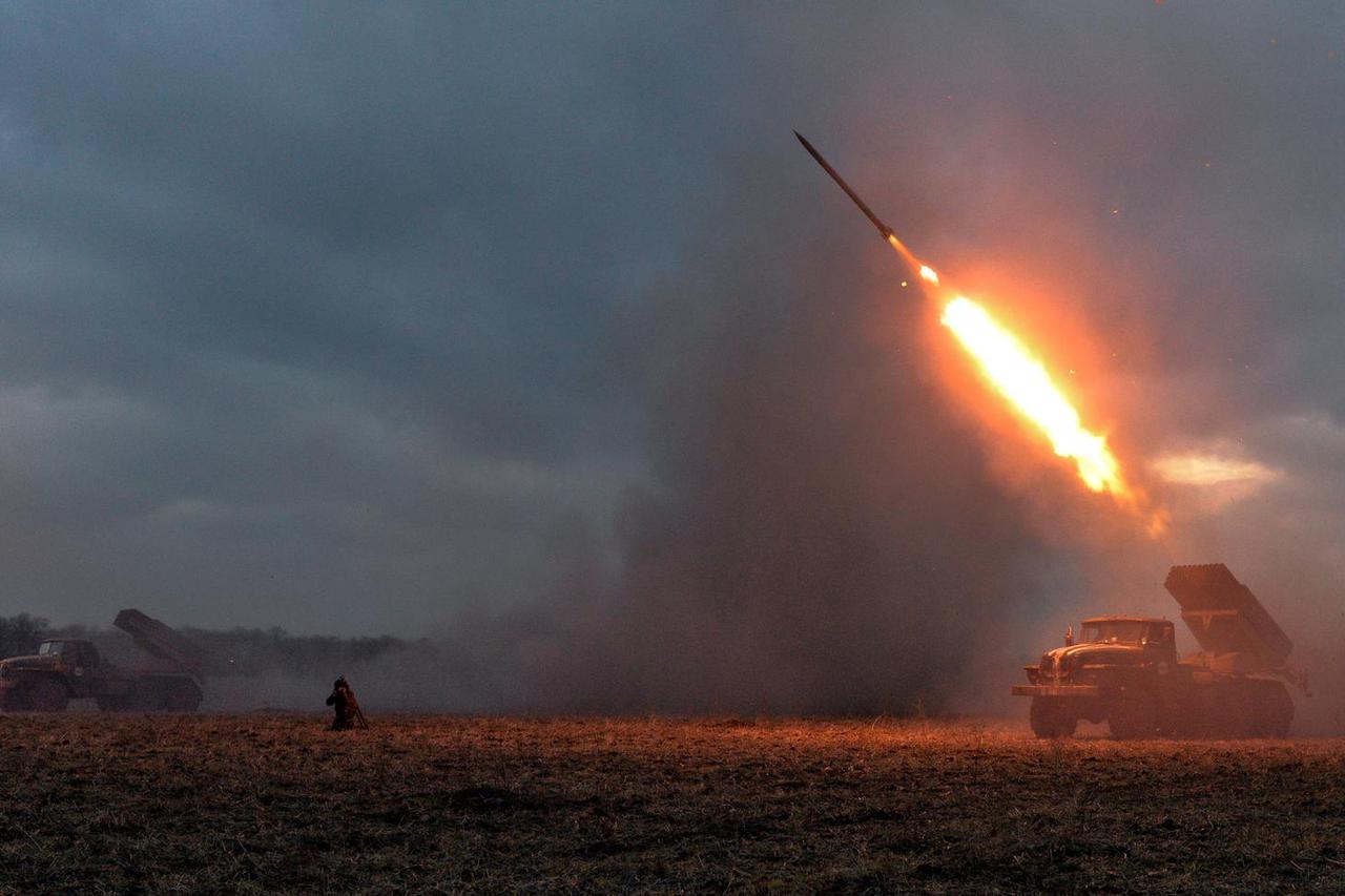 FILE PHOTO: Ukrainian servicemen launch a Grad rocket towards pro-Russian separatist forces outside Debaltseve, eastern Ukraine