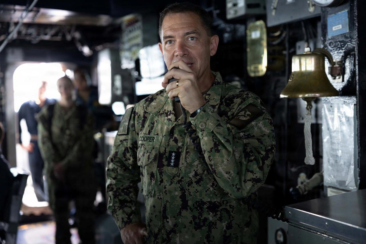 U.S. Navy Admiral Brad Cooper, commander of U.S. Central Command (CENTCOM), speaks to crew members of USS Tripoli