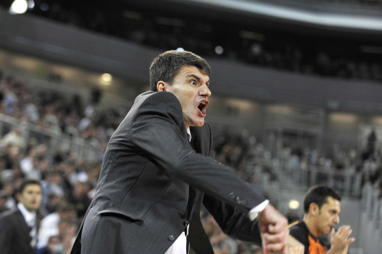 Efes Pilsen's head coach Velimir Perasovic reacts during their men's Euroleague basketball game against Union Olimpija in Ljubljana October 20, 2010. REUTERS/Srdjan Zivulovic (SLOVENIA - Tags: SPORT BASKETBALL) Picture Supplied by Action Images