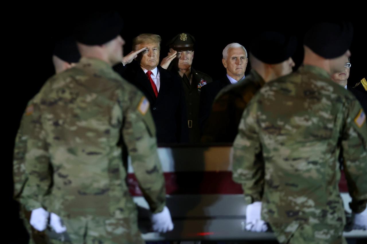 FILE PHOTO: U.S. President Donald Trump salutes the transfer case holding the remains of U.S. Army soldier Sergeant Gutierrez during a dignified transfer at Dover Air Force Base, in Dover, Delaware