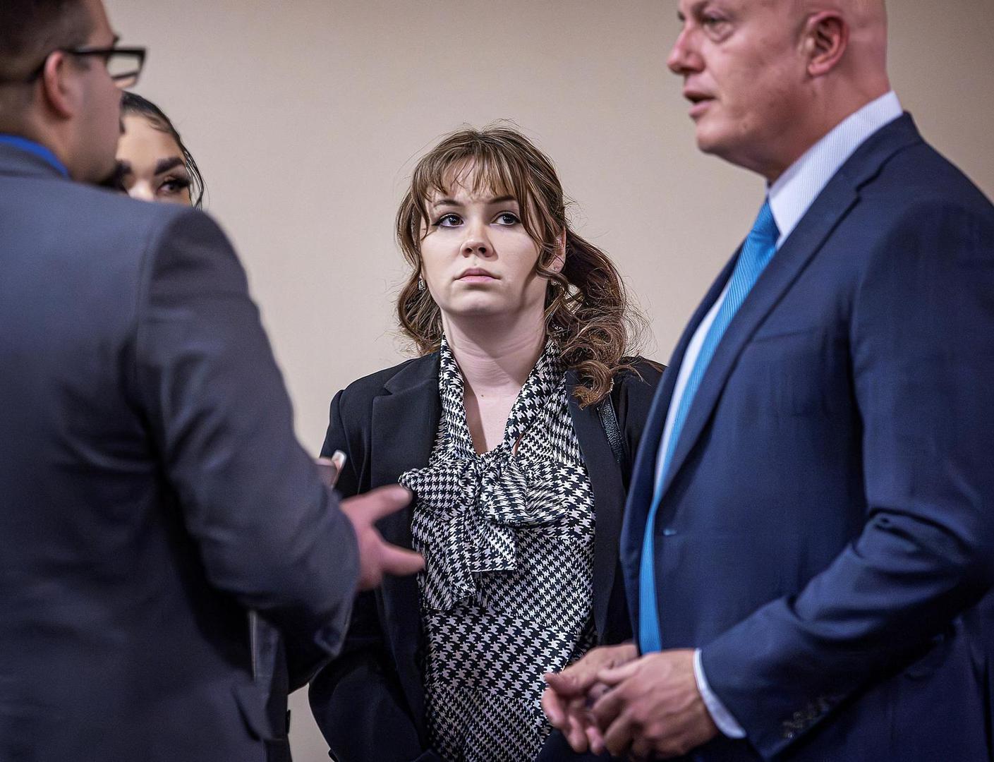 Hannah Gutierrez-Reed (center) talks with her attorney Jason Bowles (right) and her defense team during the trial against her in First District Court, in Santa Fe, N.M. on Friday, March, 1, 2024. Gutierrez-Reed, who was working as the armorer on the movie "Rust" when cinematographer Halyna Hutchins was killed by a misfire, is charged with involuntary manslaughter and tampering with evidence.    Jim Weber/Pool via REUTERS Photo: Jim Weber/The New Mexican/REUTERS