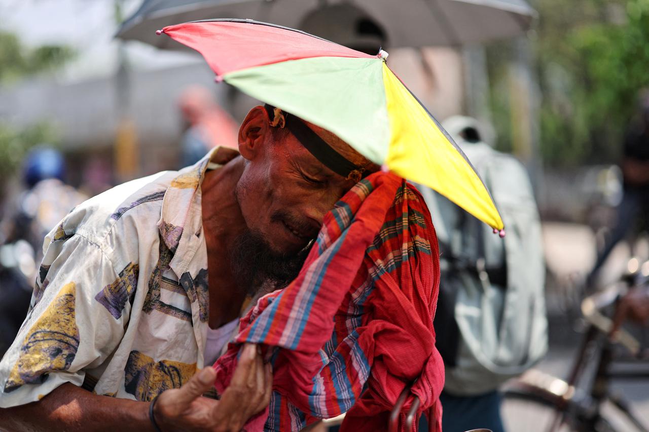 People face the countrywide heatwave, in Dhaka