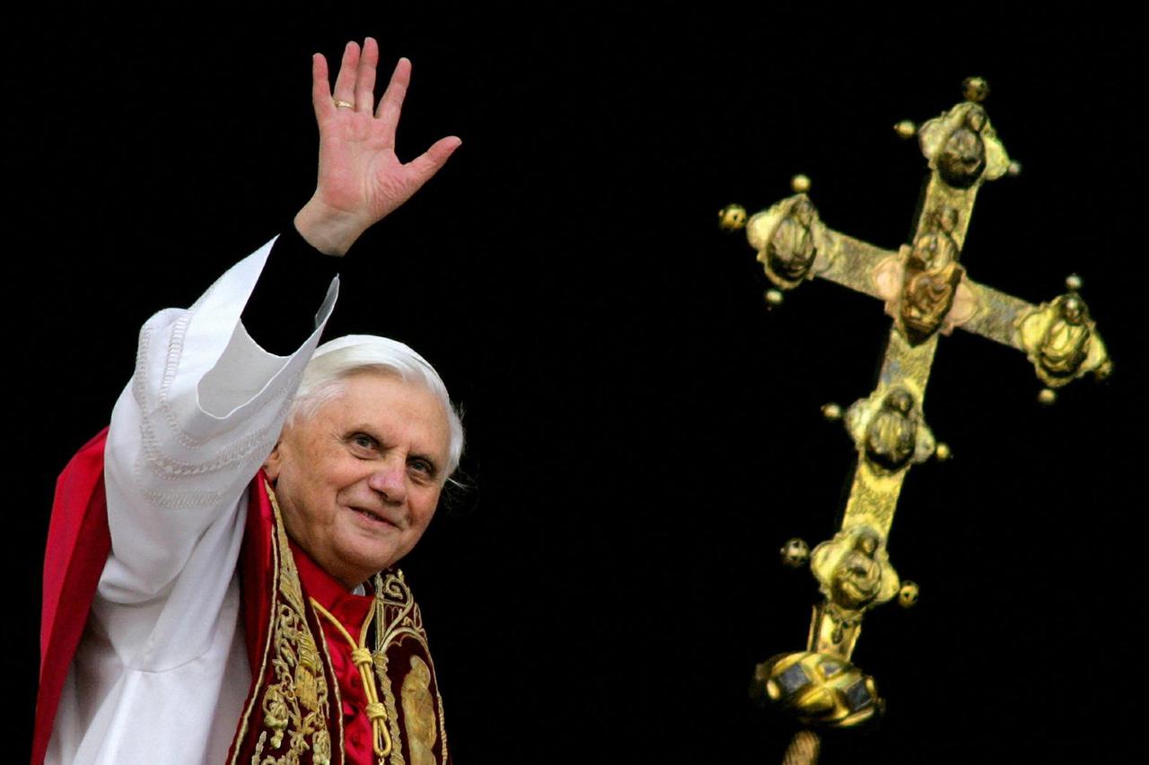 FILE PHOTO: Pope Benedict XVI, Cardinal Joseph Ratzinger of Germany, waves from a balcony of St. Peter's Basilic..