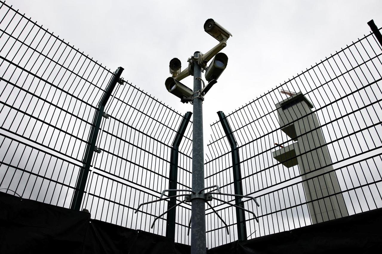 Monitoring cameras are seen at the Central Reception Center for Refugees at Berlin Brandenburg Airport, in Schoenefeld