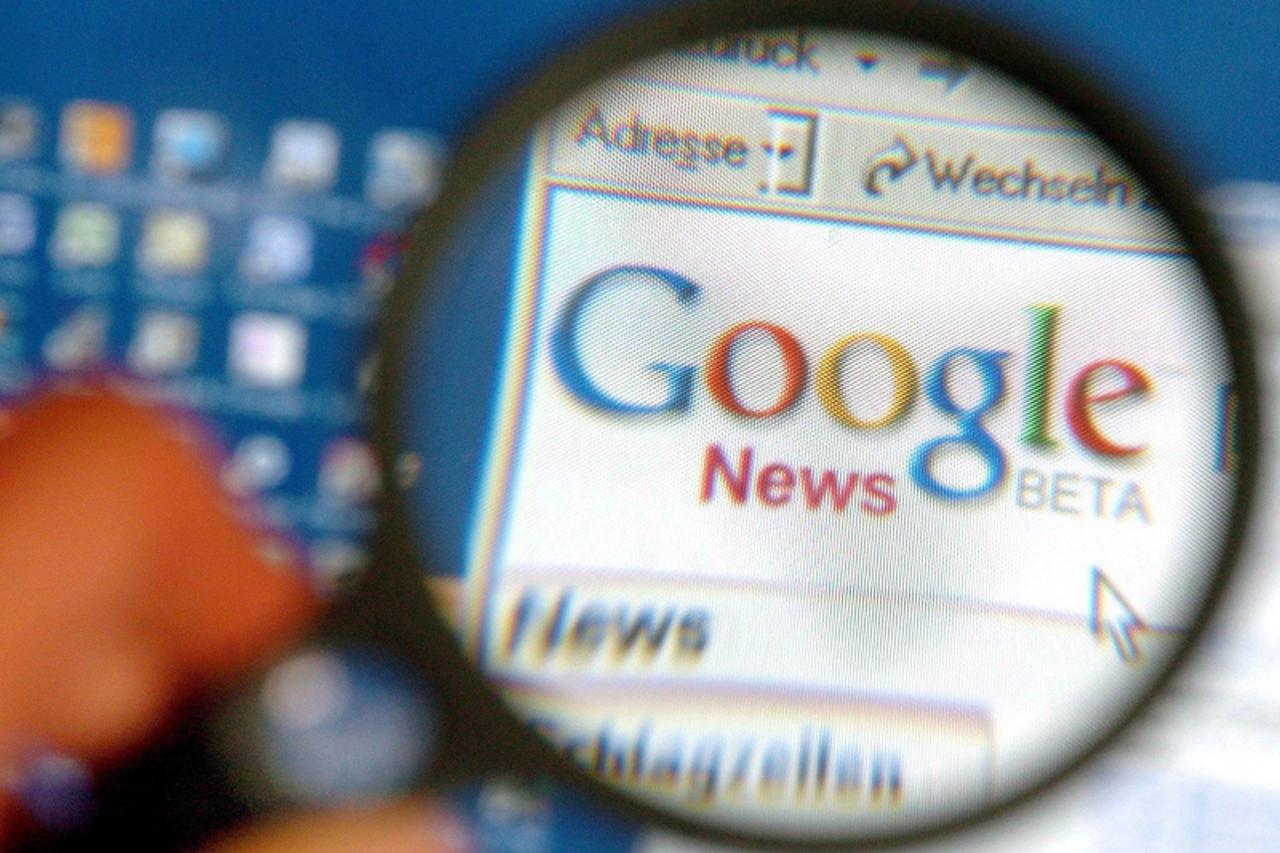 'epa00557500 (FILES) A file photograph showing a magnifying glass enlarging the logo of the internet search engine company Google on a computer monitor in Schwerin, Germany, Tuesday 17 August 2004. In
