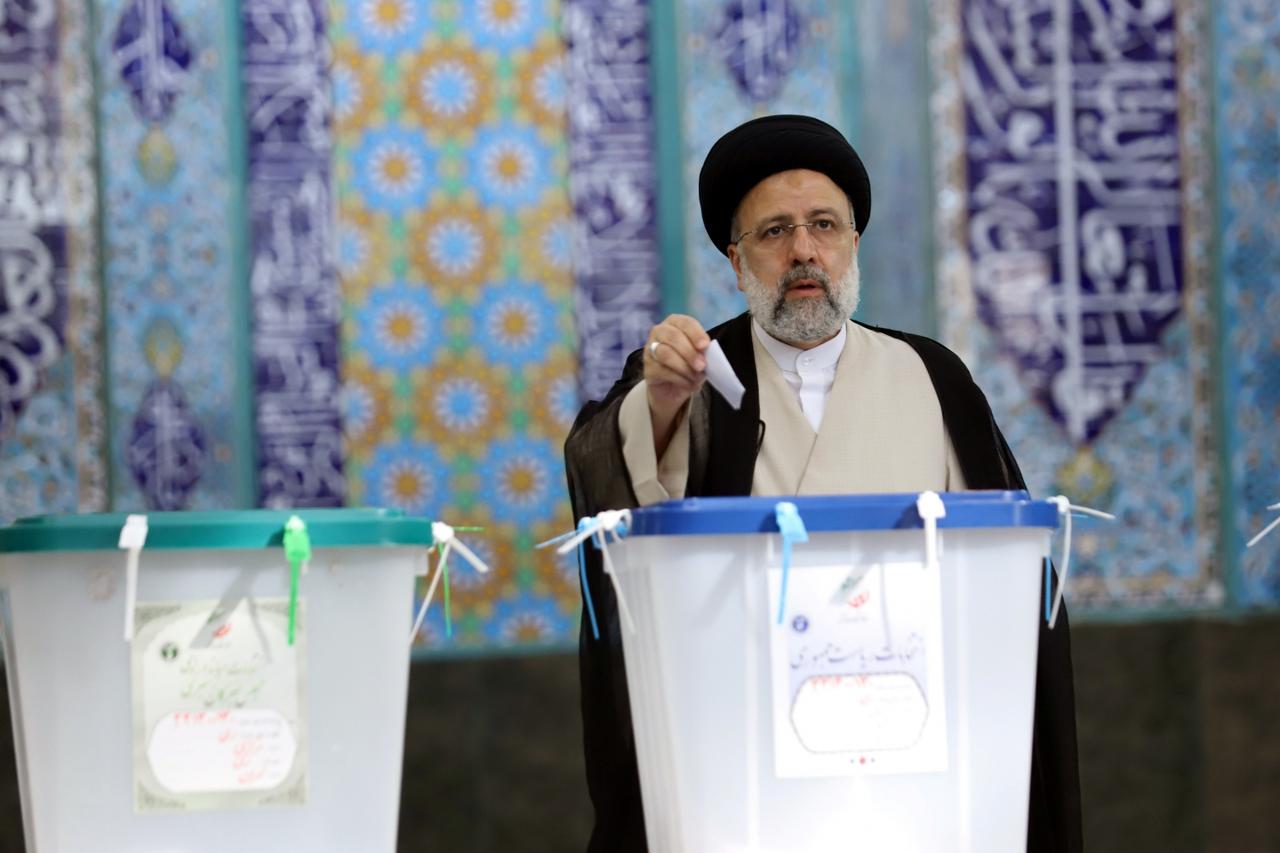 Presidential candidate Ebrahim Raisi casts his vote during presidential elections at a polling station in Tehran,